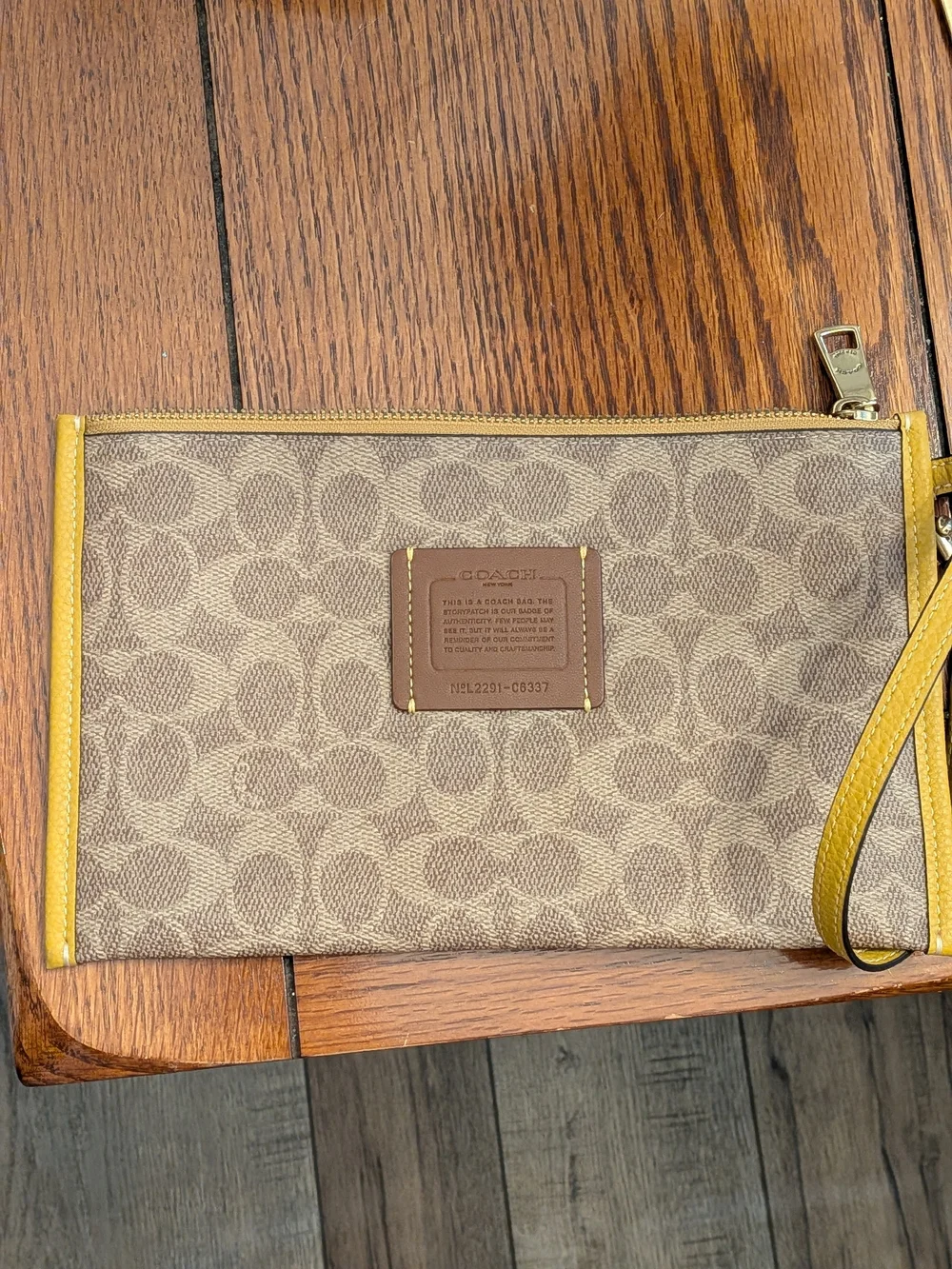 COACH Signature Canvas Wristlet with Yellow Trim
